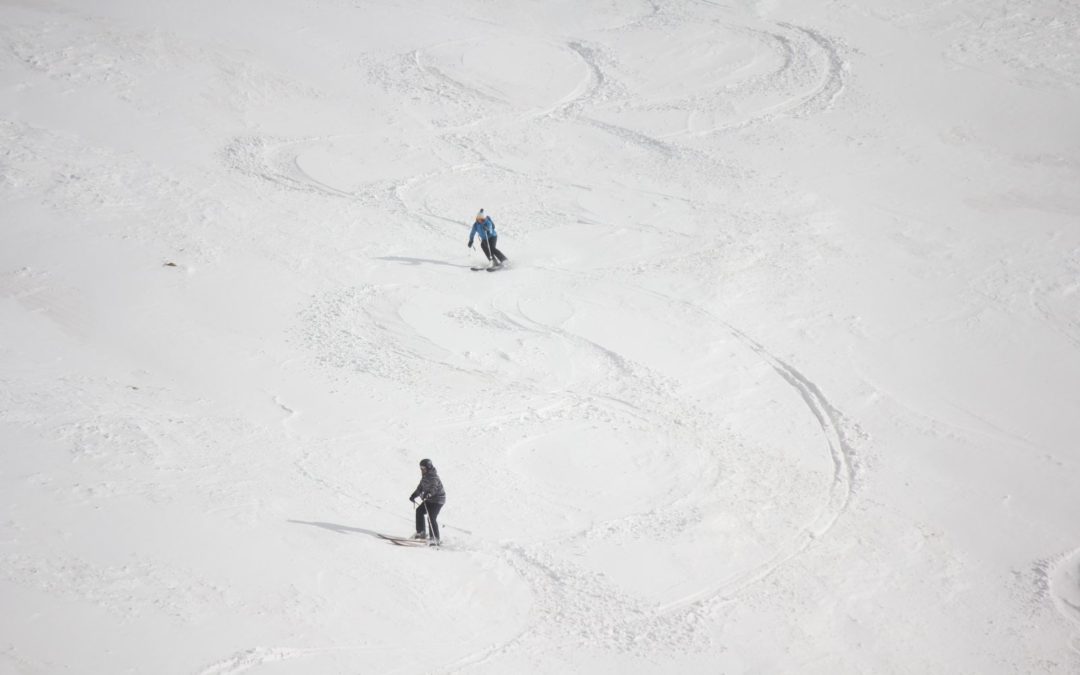Two skiers on a slope